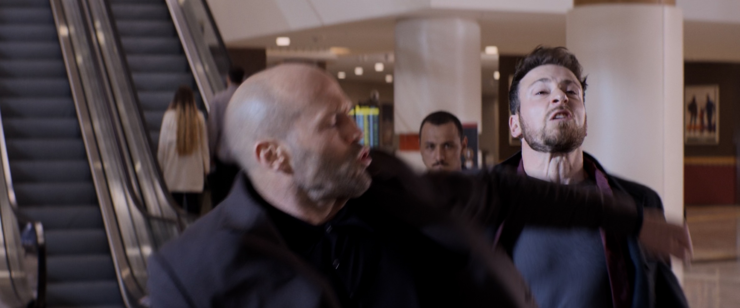 Jason Statham mid-punch